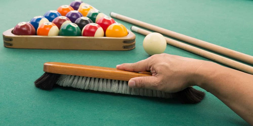 up-hand-brushing-snooker-pool-billards-table-with-bal-2021-08-30-18-49-45-utc
