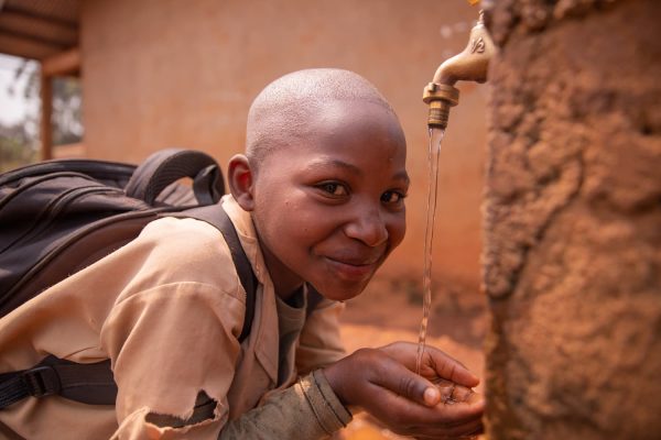 black-schoolchild-collects-water-with-his-hands-fr-2025-03-09-15-08-30-utc (1)